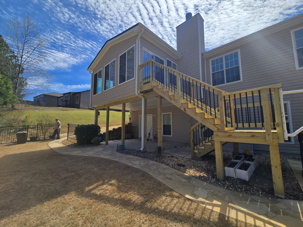 Concrete — Concrete patio under elevated deck